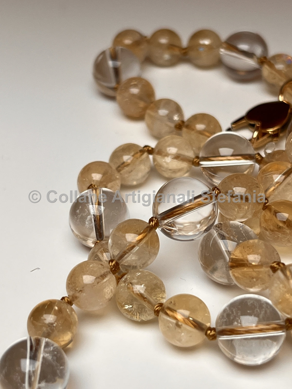 Collana lunga in quarzo citrino e quarzo ialino con dettagli laterali